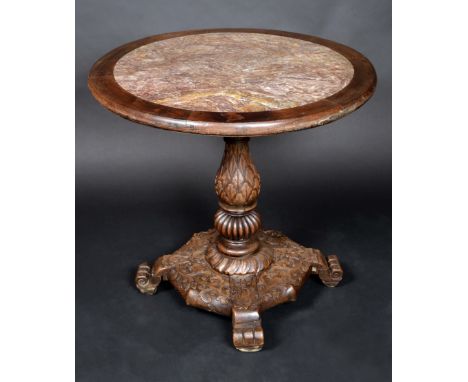 A 19th century Chinese hardwood circular centre table, the top with inset soapstone panel and bird cage support, baluster pil