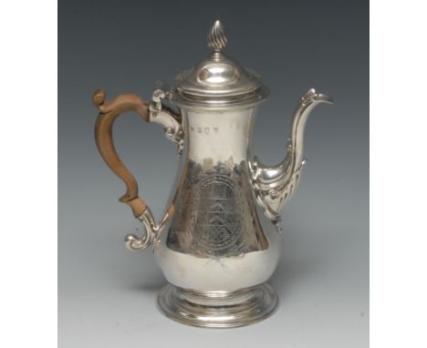 An early George III silver baluster coffee pot, hinged domed cover with spiral knop finial, capped double-scroll handle, skir