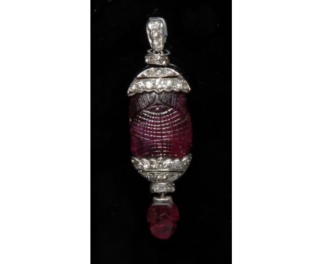 An unheated Burmese ruby and diamond pendant, the large carved cabochon ruby of approximately 18.2cts within a jewelled, diam