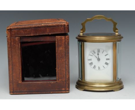 A late 19th century French lacquered brass oval carriage clock, 6cm rectangular enamel dial inscribed with Roman numerals, fo