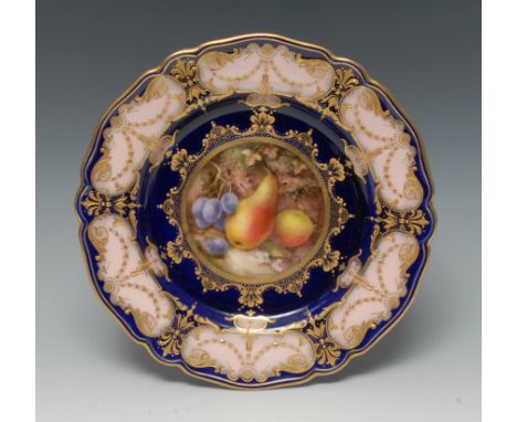 A Royal Worcester shaped circular plate, painted by Richard Seabright, signed, with ripe pears and blue berries, within a jew