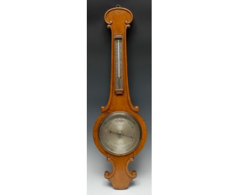 A Victorian oak wheel barometer, 19cm silvered register inscribed J Davis &amp; Son, London &amp; Derby, mercury thermometer,