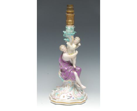 A Meissen figural candlestick, the column with classical lady, scantily draped, a child on her knee, holding with leafy colum