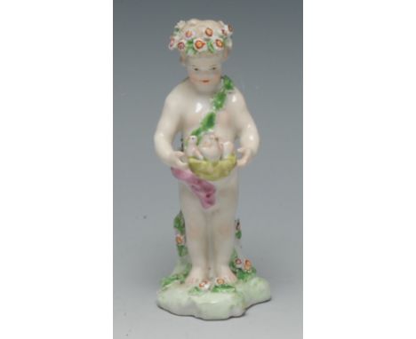 A Derby Patch Mark figure, of a cherub holding a nest of chicks, with floral garland, 12cm high, c.1770