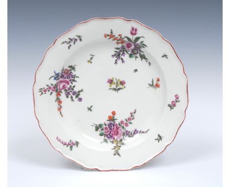 A Worcester shaped circular plate, possibly early James Giles,  painted with scattered sprigs and three colourful formal bouq
