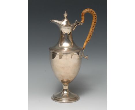 A George III design urnular wine ewer, hinged cover with knop finial, reeded borders, bright-cut engraved wrigglework borders