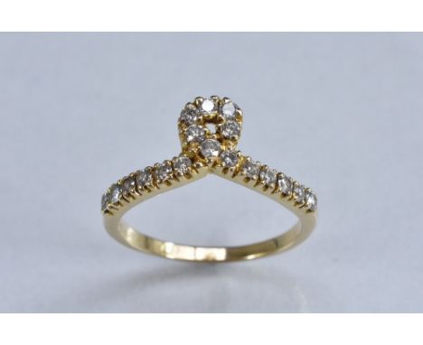 A diamond loop ring, single loop crest, linear set with eighteen round cut diamonds, total estimated diamond weight approx 0.