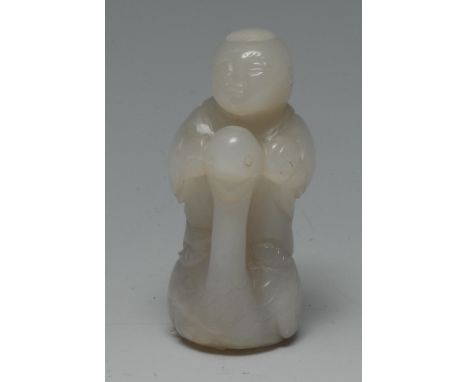 A Chinese white jade, carving of a  boy, standing  on a swan, 7cm high
