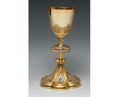 A late 19th century French Gothic Revival silver-gilt and Limoges enamel 'calice tulipe' chalice, the cup applied with filigr