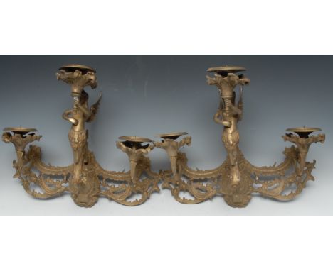 A pair of 19th century style gilt-metal three-light wall sconces, cast with a winged terminal figure and acanthus scrolls, 48