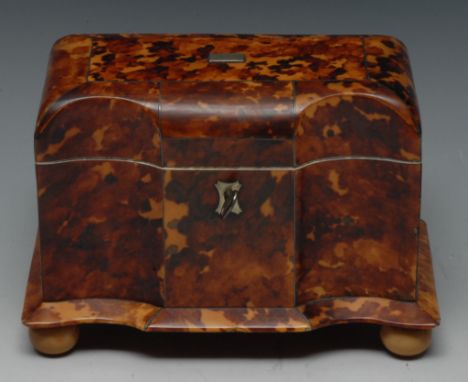 A Victorian tortoiseshell serpentine tea caddy, the interior wih two lidded compartments,  ball feet,18cm wide,  c.1850