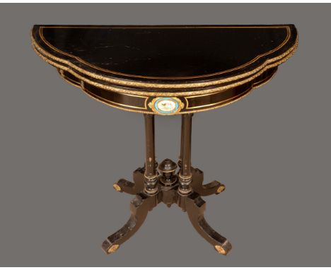 A 19th century porcelain and gilt metal mounted shaped demi-lune card table, folding top enclosing an inset baize playing sur