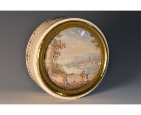 A Louis XVI Revival ivory circular snuff box, the push cover inset with a watercolour of figures in a Picturesque landscape, 