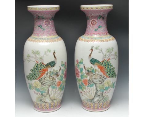 A pair of large Chinese ovoid floor vases, brightly painted in polychrome enamels with peacocks and blossoming branches, with