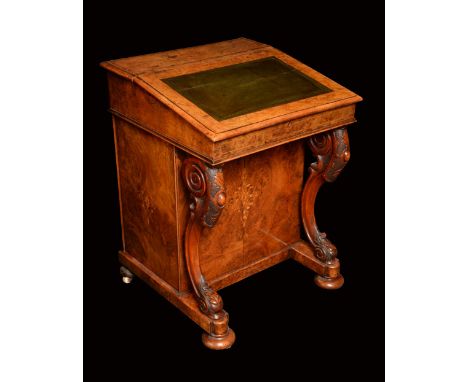 A Victorian walnut and marquetry davenport, hinged sloping top with inset leather writing surface enclosing small drawers and