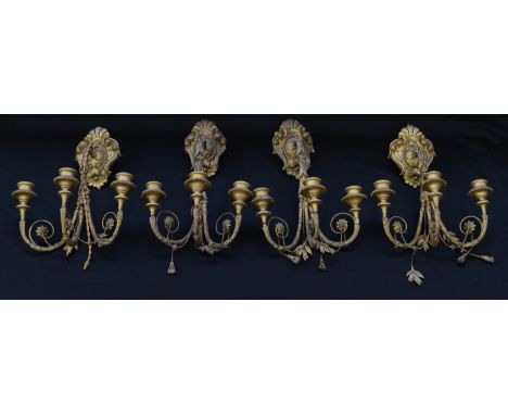 A set of four 19th century giltwood and gesso three-light wall sconces, campana sconces, acanthus grasped branches, cartouche