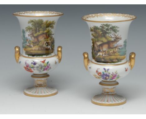 A pair of Meissen two handled pedestal campana shaped vases, decorated with a stag hunt, the verso with colourful summer flow