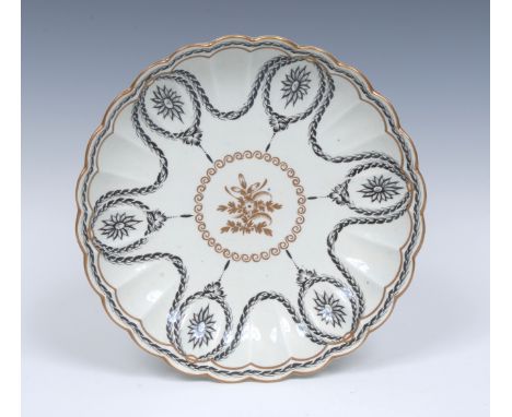 A Worcester reeded large saucer dish, possibly painted in the James Giles atelier in Neo-Classical manner in black and gilt  