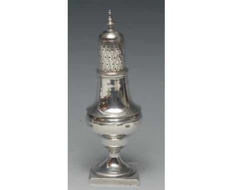 A George III silver pear shaped caster, knop finial, pierced cover engraved with diapers, rope-twist socle, square base, 16cm