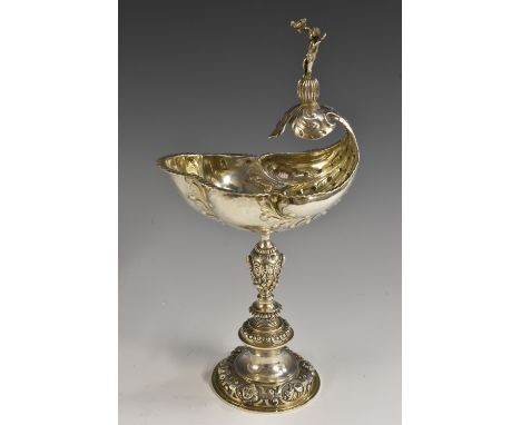 An Edwardian silver standing salt, after a Renaissance model, the shell bowl crested by a figure, knopped stem and domed foot