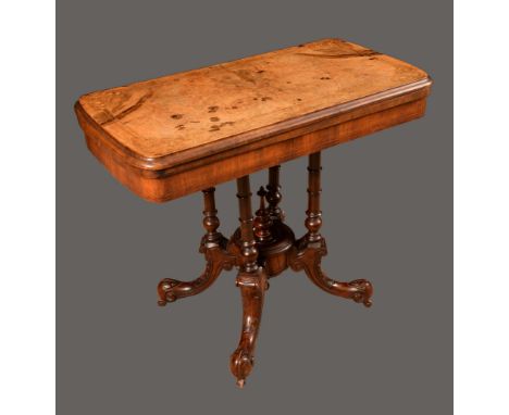 A Victorian burr walnut and marquetry rounded rectangular card table, folding top enclosing an inset baize lined playing surf