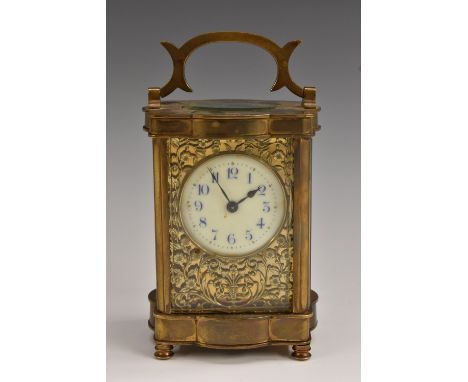 A late 19th century French lacquered brass serpentine carriage timepiece, 4.5cm enamel dial inscribed with Arabic numerals, o