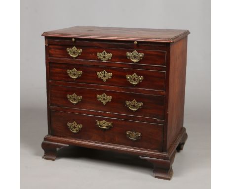 A George II mahogany bachelors chest. Incorporating a brushing slide and with four graduated drawers raised on ogee bracket f