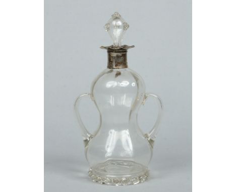 A Victorian glass twin handled decanter with silver collar and of double gourd form with stopper applied with raspberry prunt