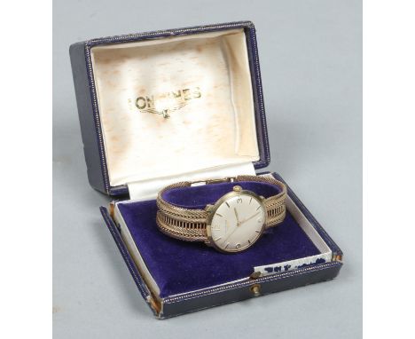 A gentleman's 9 carat gold Longines manual bracelet watch in original case. With satin dial, subsidiary seconds, baton and Ar