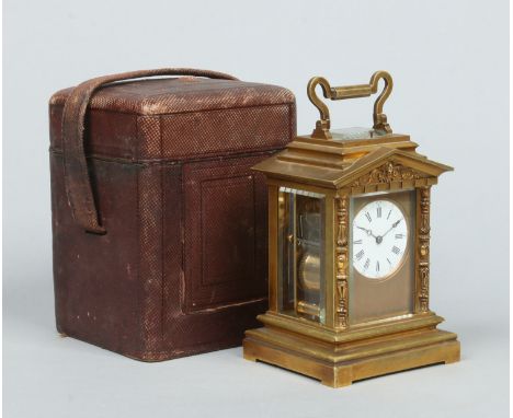 A 19th century lacquered brass carriage clock of architectural form in fitted leather case. With triangular entablature adorn