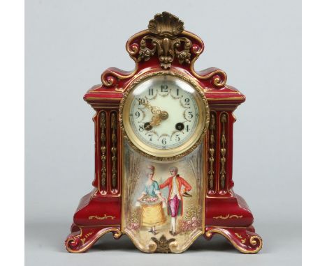 A 19th century French Sevres style pottery cased mantel clock. Claret ground, gilded and enamelled with a courting scene sign