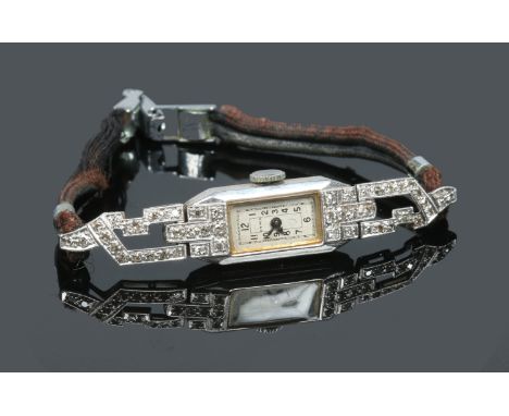 A ladies Art Deco platinum Cyma manual cocktail watch set with diamonds, 10mm wide. Condition Report. To be used as a guide o