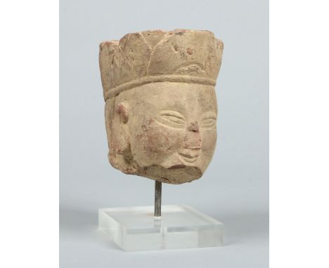 An ancient Chinese carved Buddhistic stone head mounted on a later plinth, possibly Ming dynasty, 24.5cm. Condition Report. T