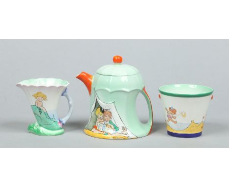 A Shelley Art Deco nursery three part tea service designed by Hilda Cowhan. The teapot and cover moulded in the form of a ten