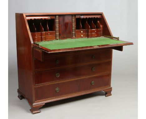 A Regency figured mahogany bureau. With fitted waterfall interior having faux book spines, raised on graduated drawers and su