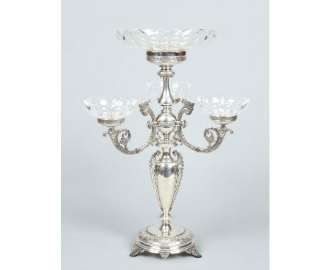 A Victorian silver plated four branch epergne with fluted cut crystal bowls. Decorated with Celtic style strapwork and raised