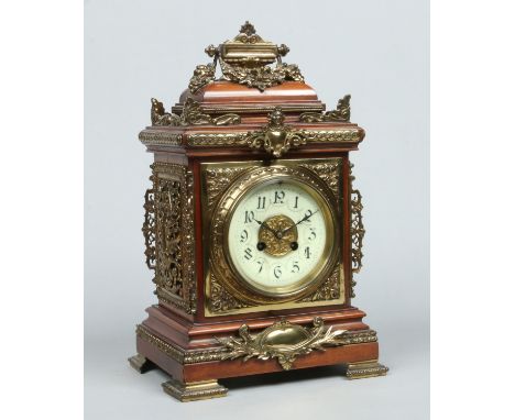 A Victorian mahogany and gilt brass mounted mantel clock. Housing a French 8 day cylinder movement striking on a gong, stampe