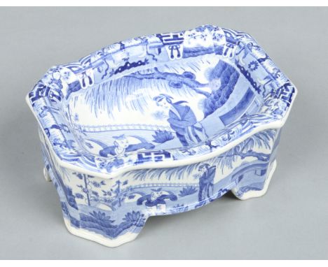 A Spode dog bowl printed in underglaze blue with the Jumping Boy pattern. Printed and impressed marks c.1820, 21.5cm wide. Co