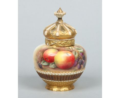 A Royal Worcester potpourri jar with pierced cover by Peter D. Love. Painted with apples and blackberries and with white grap