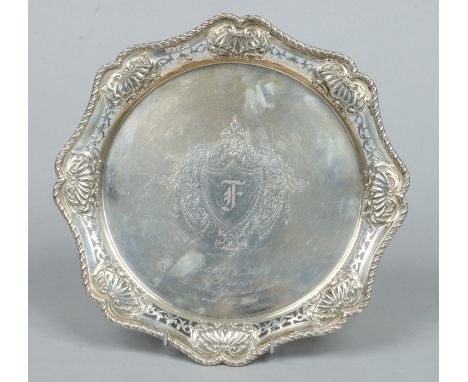 An Edwardian scalloped silver salver by The Alexander Clark Manufacturing Co. With cast ropetwist rim and pierced border with