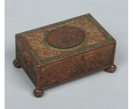 An Austrian clockwork automaton singing bird box raised on filigree ball feet. Decorated in relief with panels of stag huntin