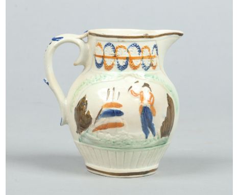An early 19th century prattware jug. Moulded and coloured in enamels to depict Nelson and Britannia, 12.25cm. Condition Repor
