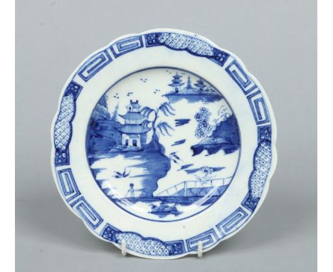 A Caughley lobed blue and white dessert plate decorated in the Weir pattern. Painted in underglaze blue with a formal Chinese
