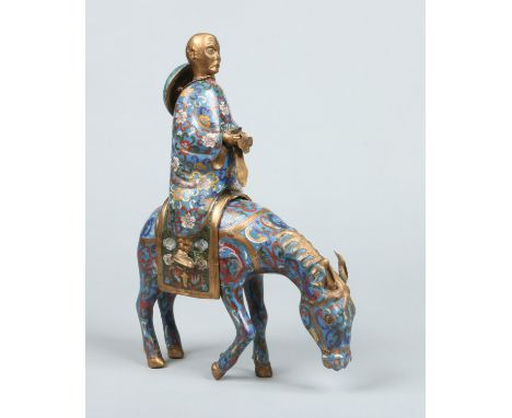 A Chinese cloisonne figural censor. Formed as an Immortal on horseback, holding a scroll and with a hat tied around his neck.