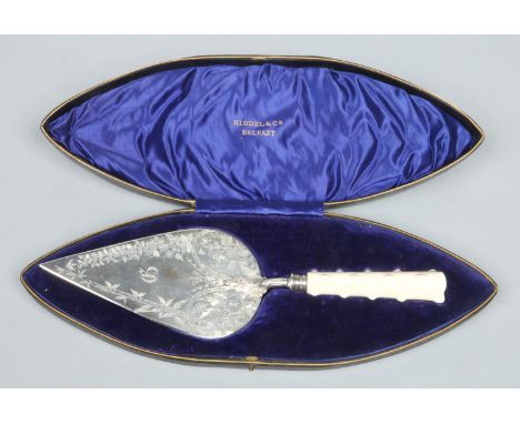 An Edwardian silver and ivory presentation trowel by Lee & Wigfull in fitted case. Engraved with Aesthetic motifs and a Gothi