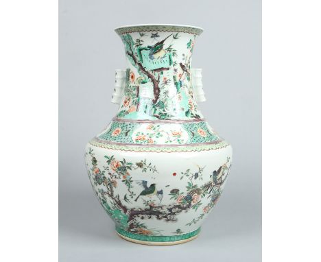 A large 19th century Chinese famille vert arrow vase. Decorated with rocks, prunus blossom and birds. Unmarked, 54cm. Conditi