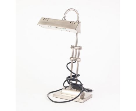 MODERN BRUSHED STEEL ADJUSTABLE DESK LAMP, with horizontal shade and oblong base, 15" (38.1cm) high, fitted with Continental 