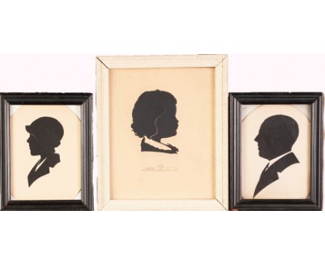 CUT CARD PROFILED HEAD PORTRAIT OF A CHILD, indistinctly signed, 5 ¼" x 4 ¼" (13.3cm x 10.8cm), and a SIMILAR, SMALLER PAIR, 