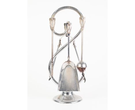 STYLISH FRENCH CHROME PLATED FIRESIDE COMPANION, modelled as a large 'S' on a circular base, housing a set of four fire tools
