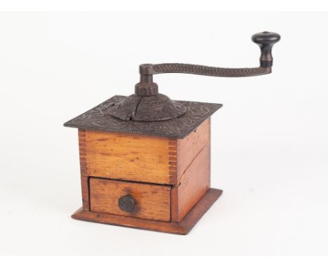FRENCH BLONDEWOOD AND CAST IRON BYGONE COFFEE GRINDER, of through dovetail construction with drawer to the front